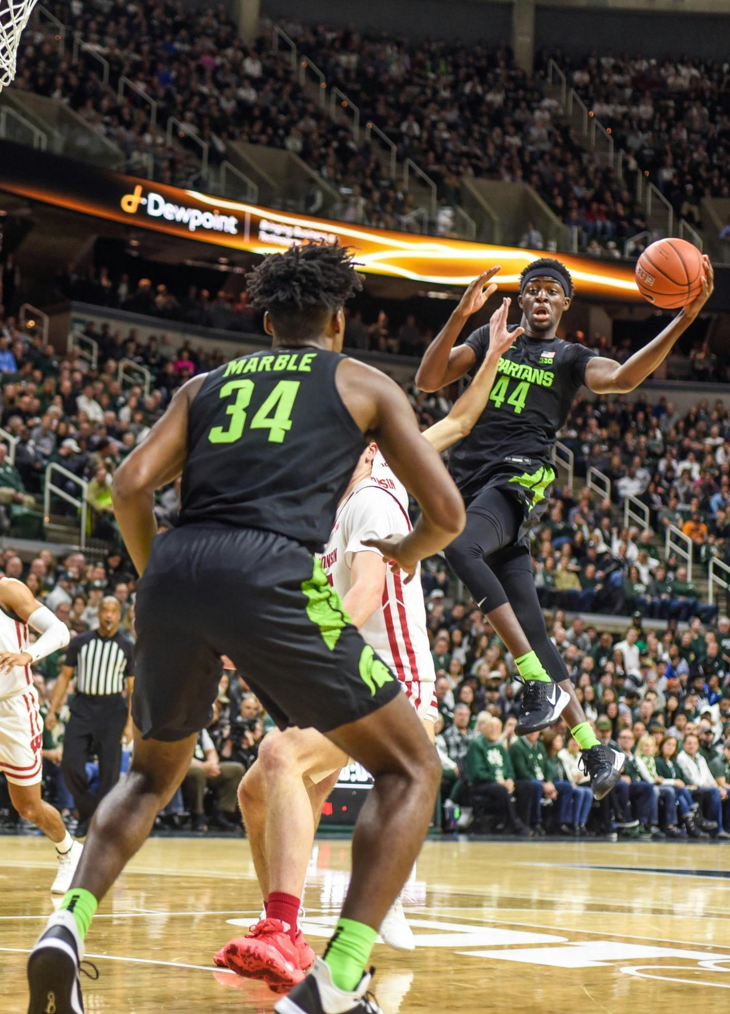 <p>Sophomore forward Gabe Brown (44) passes the ball during the game against Wisconsin at Breslin Center on Jan. 17. The Spartans lead the Badgers at the half, 35-20.</p>