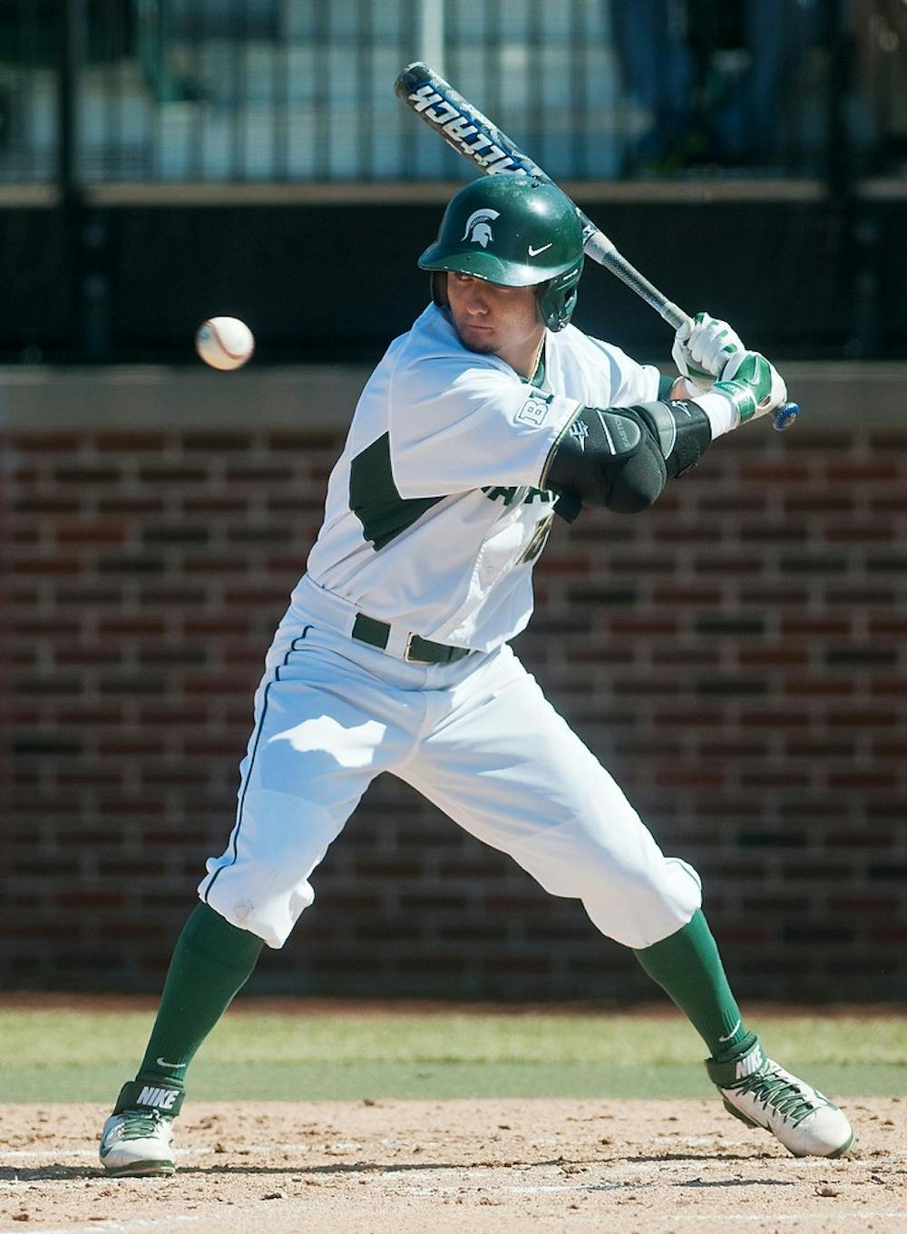 <p>Junior center fielder Anthony Cheky prepares to swing during the home opener against Oakland on April 2, 2014, at McLane Baseball Stadium at Old College Field. The Spartans defeated the Grizzlies, 5-3. Danyelle Morrow/The State News</p>