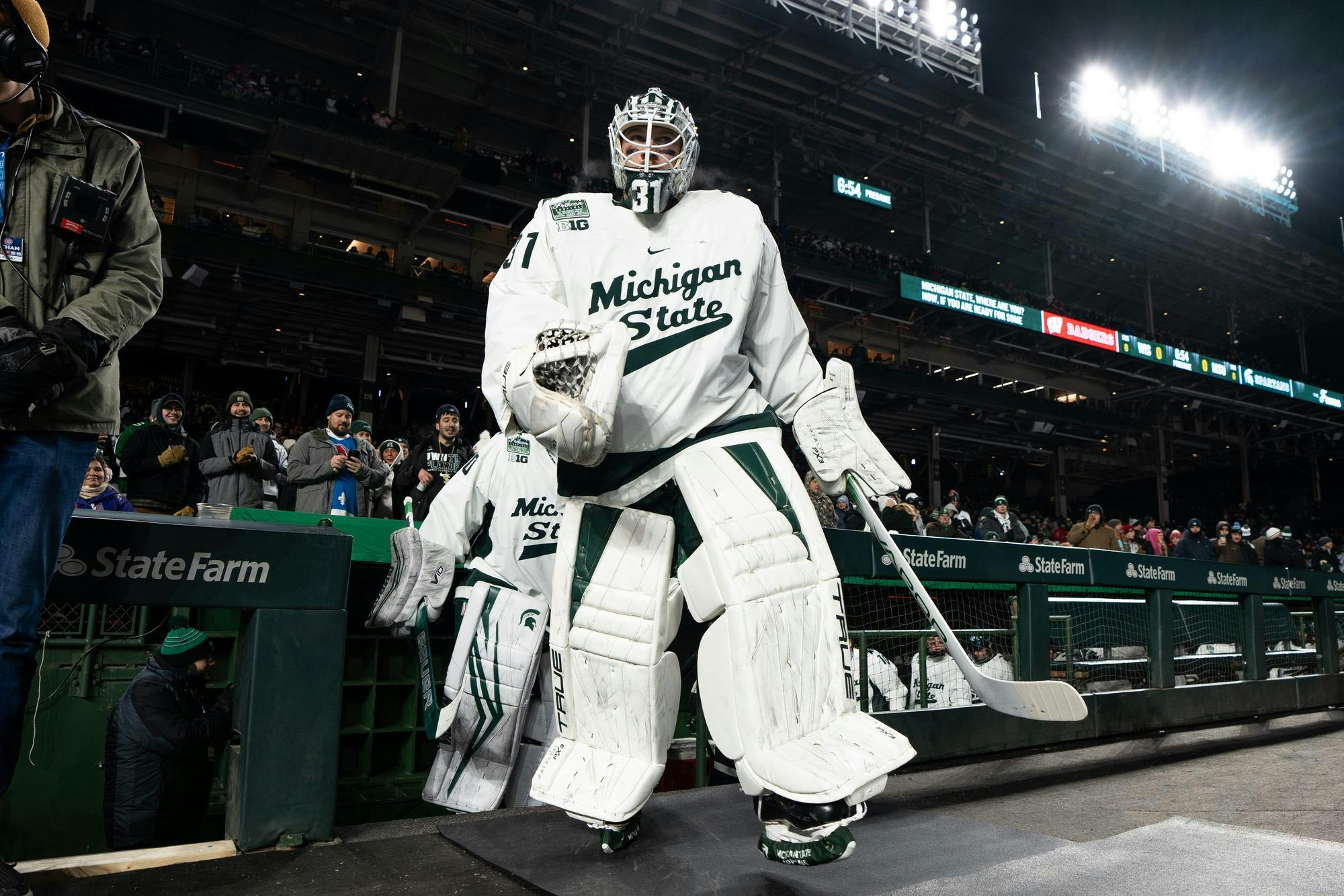 Michigan State sophomore goaltender Luca Di Pasquo (31) walks out of the dug out of Wrigley Field on Jan. 4, 2024.