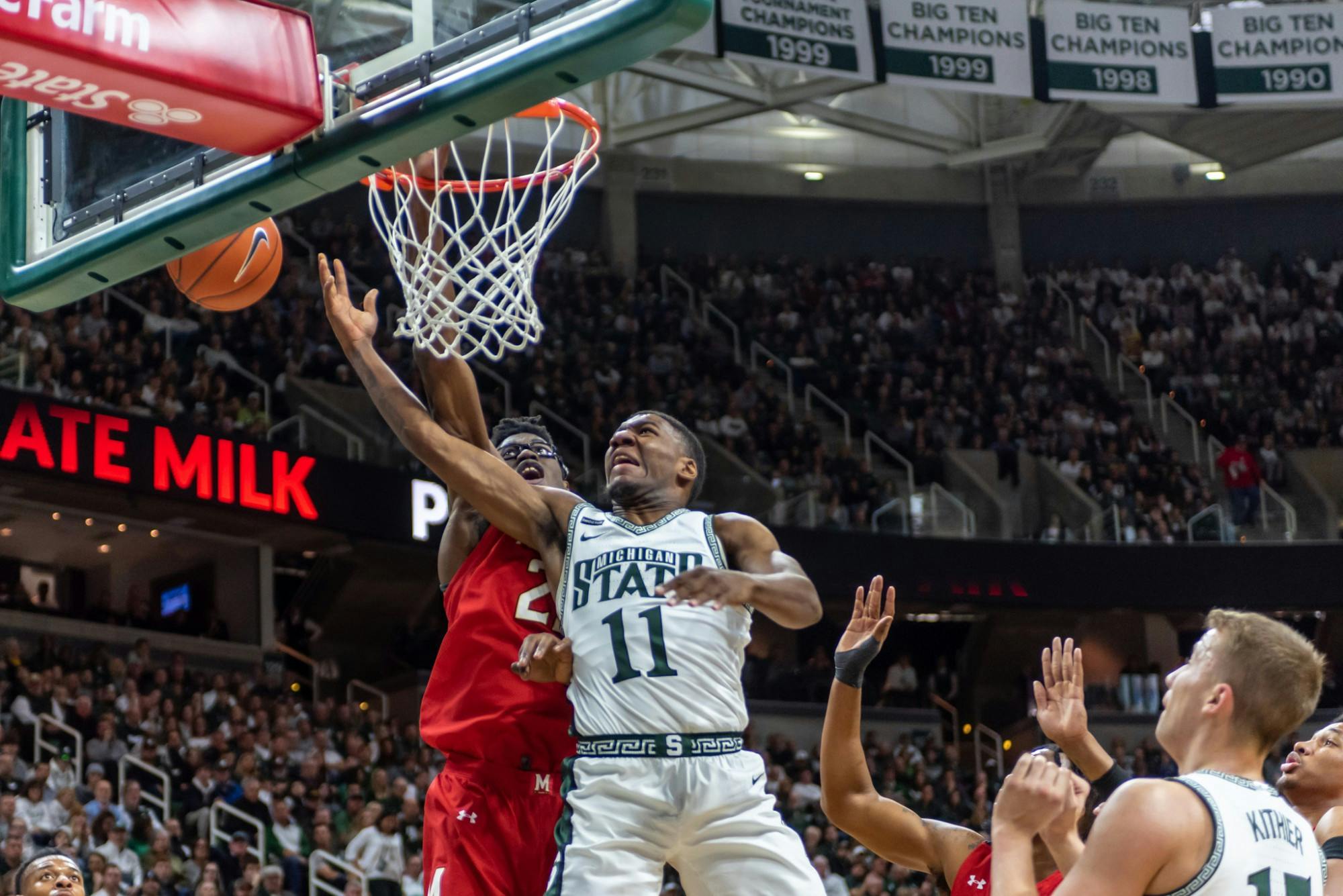 <p>Sophomore Aaron Henry (11) is fouled on a shot by Maryland’s Jalen Smith (25). The Spartans fell to the Terrapins, 60-67, at the Breslin Student Events Center on Feb. 15, 2020. </p>