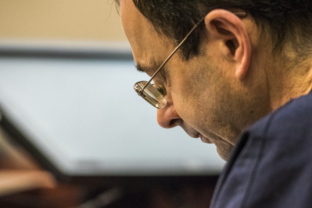 Ex-MSU and USA Gymnastics Dr. Larry Nassar looks down during the fourth day of his sentencing on Jan. 19, 2018 at the Ingham County Circuit Court in Lansing. (Nic Antaya | The State News)
