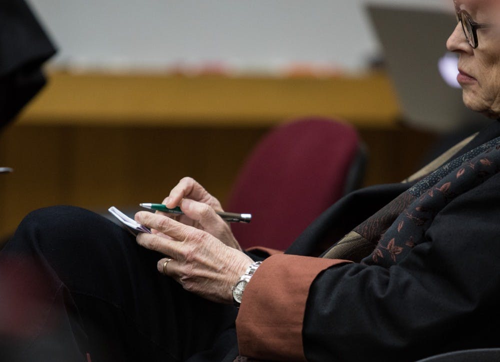 Former Michigan State President Lou Anna K. Simon takes notes during a preliminary hearing at Eaton County District Court April 16, 2019. Simon is charged with four counts of lying to a peace officer, including two felonies.