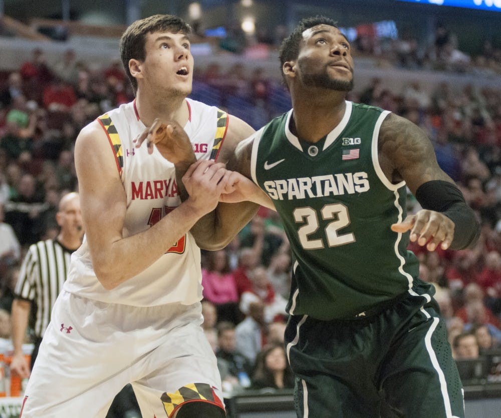 <p>Senior forward/guard Branden Dawson prepares for a rebound over Maryland freshman forward Michal Cekovsky Mar. 14, 2015, during the game against Maryland at the Big Ten Tournament at United Center in Chicago. The Spartans defeated the Terrapins, 62-58. Kelsey Feldpausch/The State News</p>