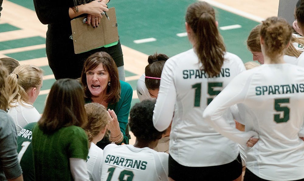 	<p>Head coach Cathy George talks with the her team during the volleyball game against Ohio State Oct. 20, 2012 at Jenison Field House. <span class="caps">MSU</span> lost the game 3-1 and is set to play against Indiana on Oct. 26. Danyelle Morrow/The State News</p>