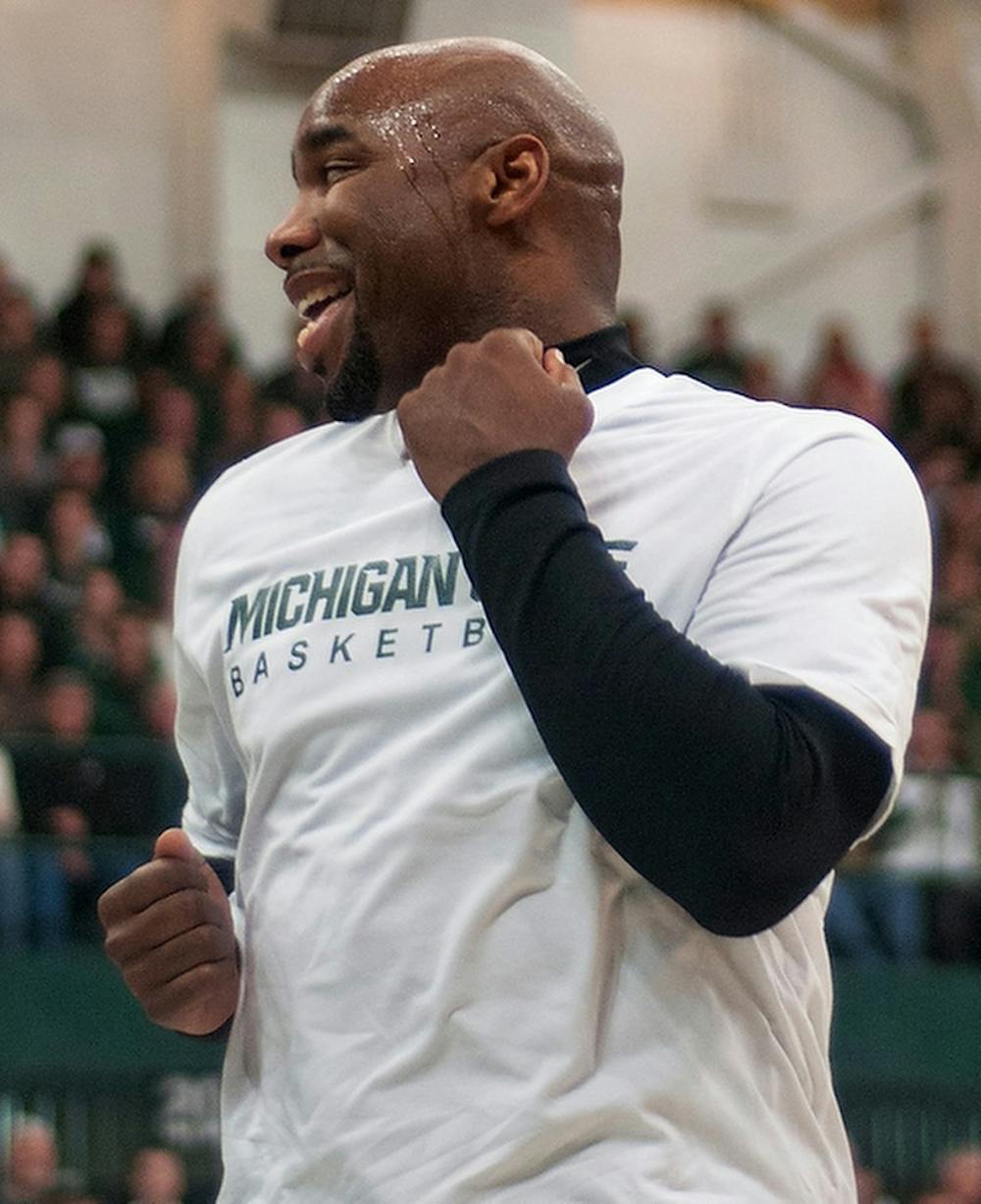 	<p>Former <span class="caps">MSU</span> guard Mateen Cleaves celebrates a point by dancing underneath the basket during the <span class="caps">MSU</span> men&#8217;s basketball alumni game Friday at Jenison Field House. Cleaves scored four points and dished out five assists during the game. Danyelle Morrow/The State News</p>