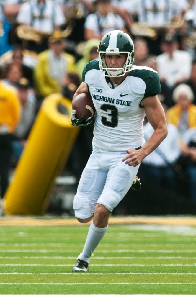 	<p>Junior punter Mike Sadler runs down the field after faking a punt in the fourth quarter of the game against Iowa, Oct. 5, 2013, at Kinnick Stadium in Iowa City, Iowa. <span class="caps">MSU</span> defeated Iowa after trailing at halftime, 26-14. Danyelle Morrow/The State News</p>