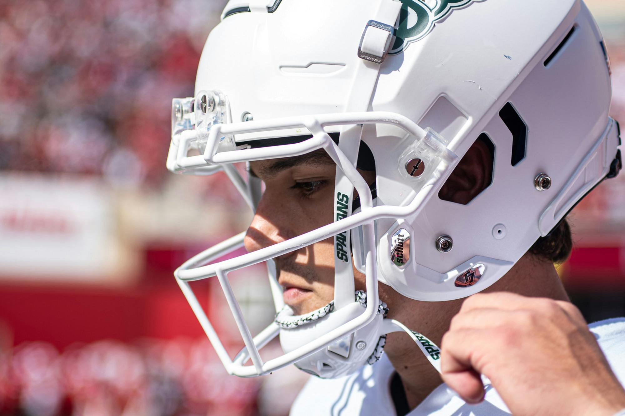 <p>Redshirt sophomore quarterback Payton Thorne takes his helmet off following a three-and-out.</p>