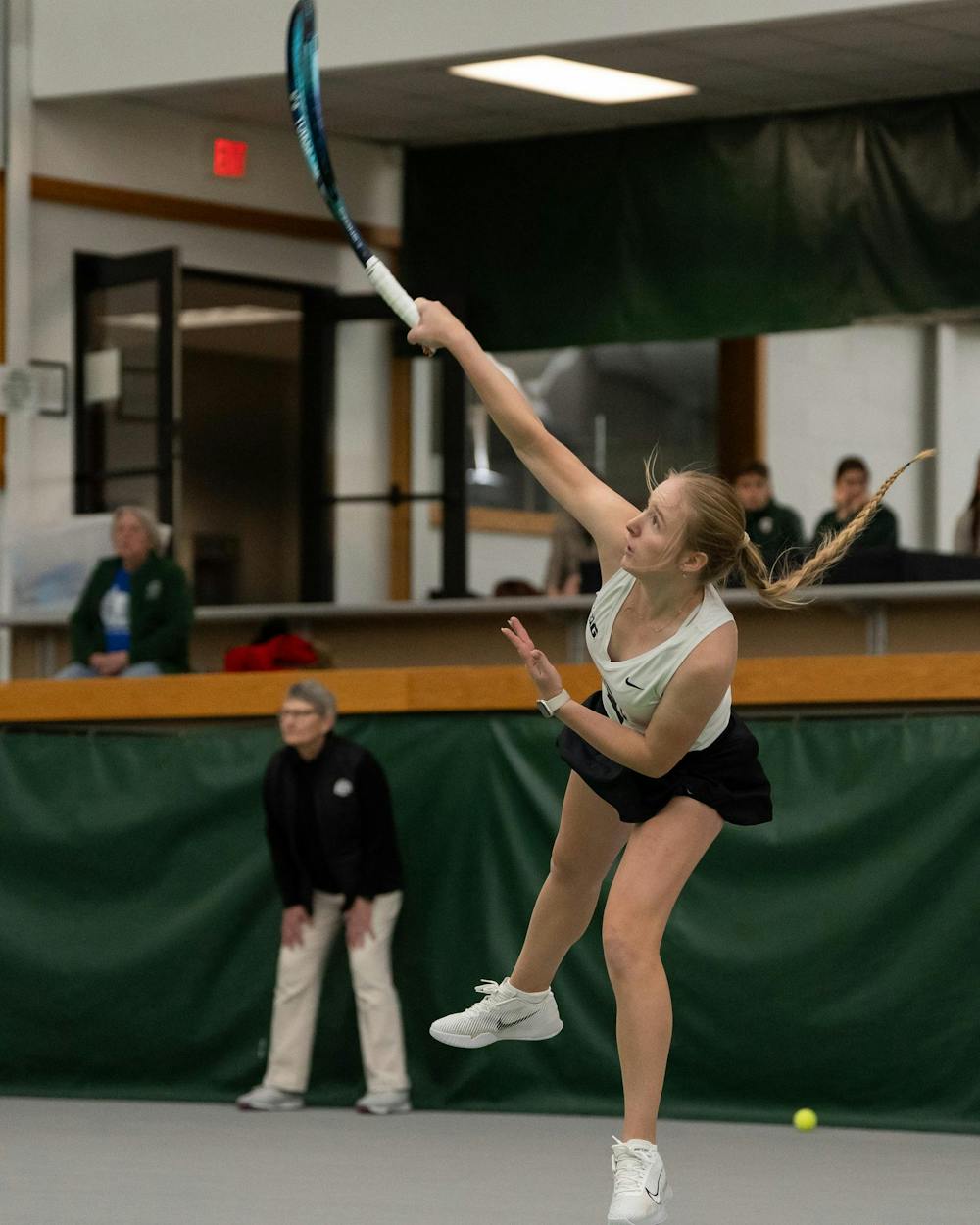 <p>MSU redshirt sophomore Hanna Tsitavets serves against Xavier in their doubles match at the MSU Indoor Tennis Center on Jan. 24, 2025. Tsitavets went on to win the match six to four.</p>