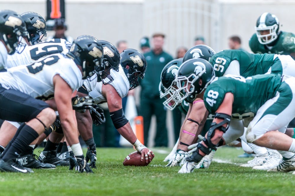 The Spartans defensive line prepares for the ball to get snapped during the game against Purdue on Oct. 27, 2018 at Spartan Stadium. The Spartans defeated the Boilermakers 23-13.