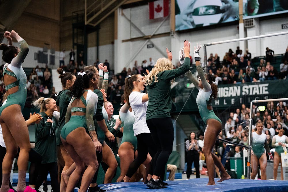 <p>Freshman All-Around Nikki Smith celebrating after finishing her dismount at the MSU vs. Penn State meet at the Jenison Field House on Feb. 4, 2023. The Spartans beat the Nittany Lions 197.450 - 195.475.</p>