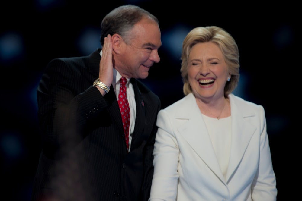 Democratic Presidential Candidate Hillary Clinton, left, and her Vice Presidential running mate Tim Kaine celebrate after her acceptance speech on the final day of the Democratic National Convention on July 28, 2016 at Wells Fargo Center in Philadelphia.  Clinton became the first woman to accept the nomination of a major party for the presidential election. 