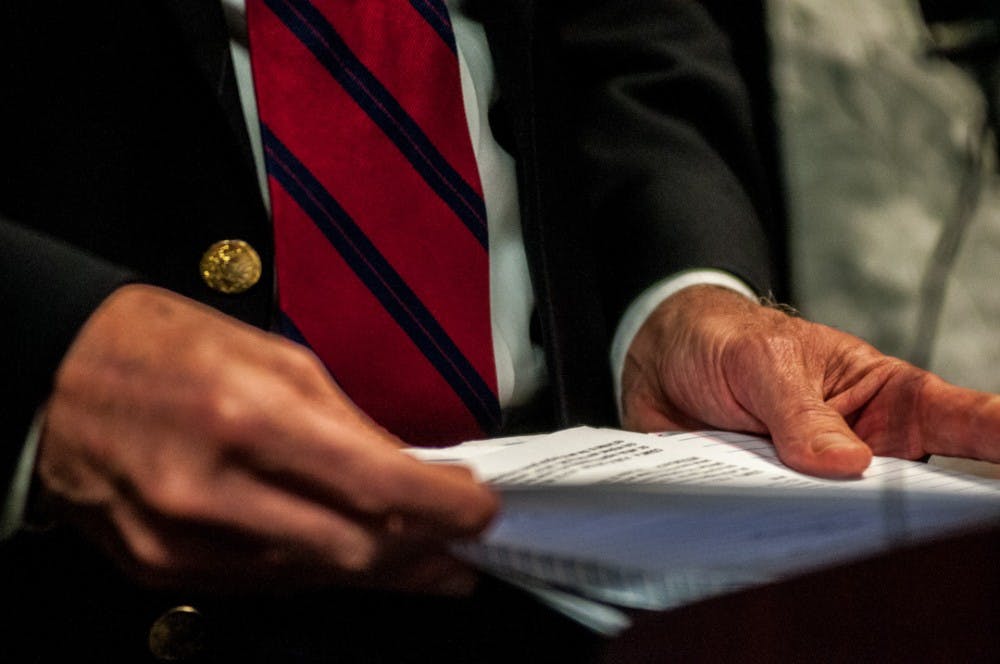 <p>Special prosecutor and lead investigator Bill Forsyth reads paragraphs from an affidavit concerning charges against former Dean of Osteopathic Medicine, William Strampel, to the media March 27, 2018 at 525 W. Ottawa St. in Lansing.&nbsp;</p>