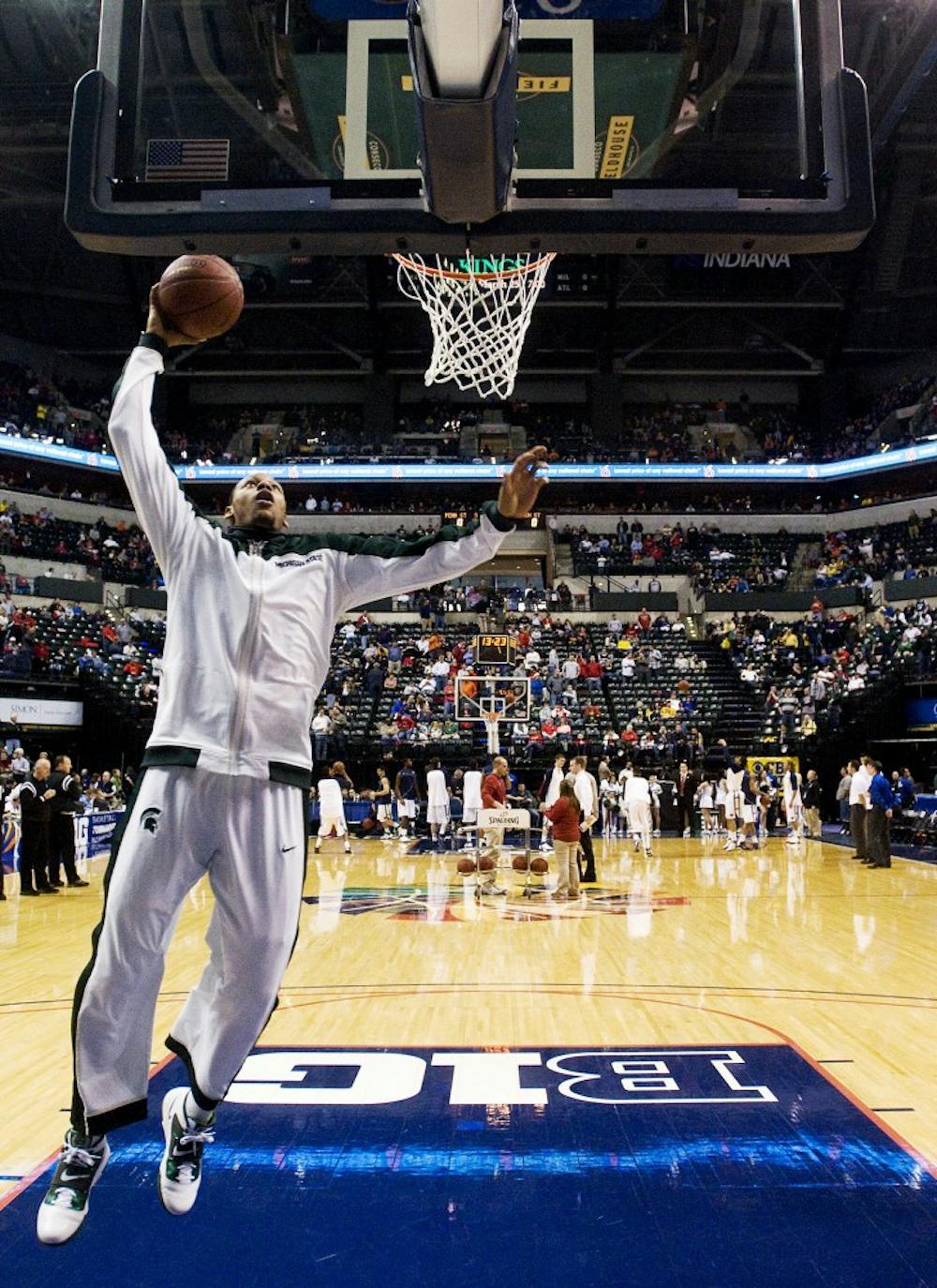 Freshman center Adreian Payne warms up before the game Saturday at Conseco Fieldhouse in Indianapolis, Ind. The Spartans lost to the Nittany Lions 61-48. Matt Radick/The State News