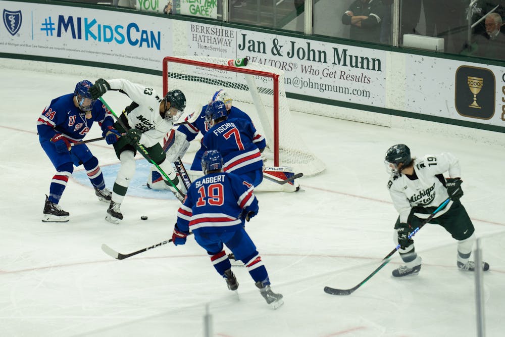 <p>Senior left wing Jagger Joshua (23) attempts to score at Munn Ice Arena on Oct. 1, 2022. The Spartans lost to the USNTDP 4-3.</p>
