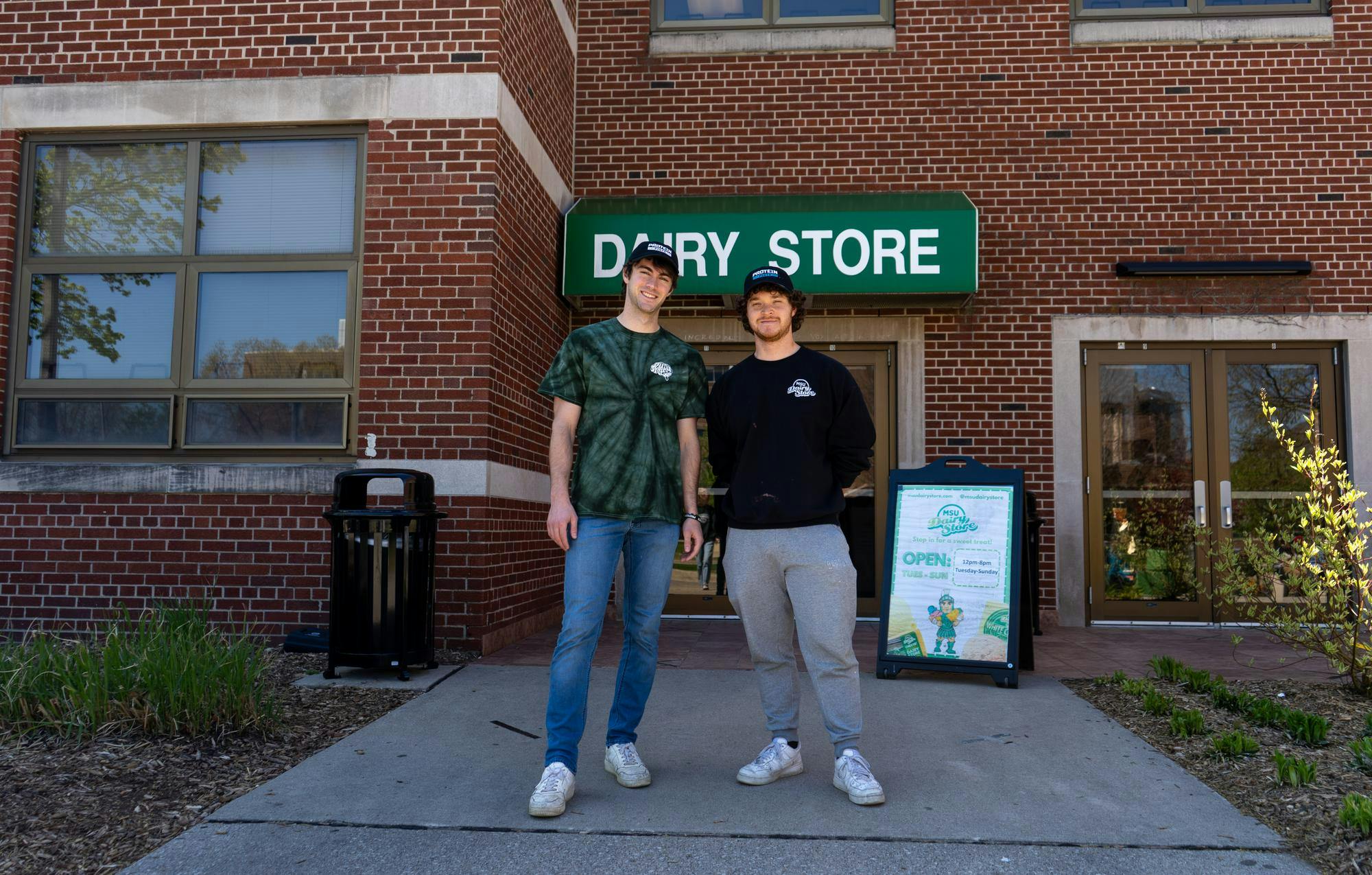 <p>Co-creators of Protein Pints, Paul Reiss and Michael Meadows, pose for a portrait outside of the MSU Dairy Store on April 25, 2024.</p>