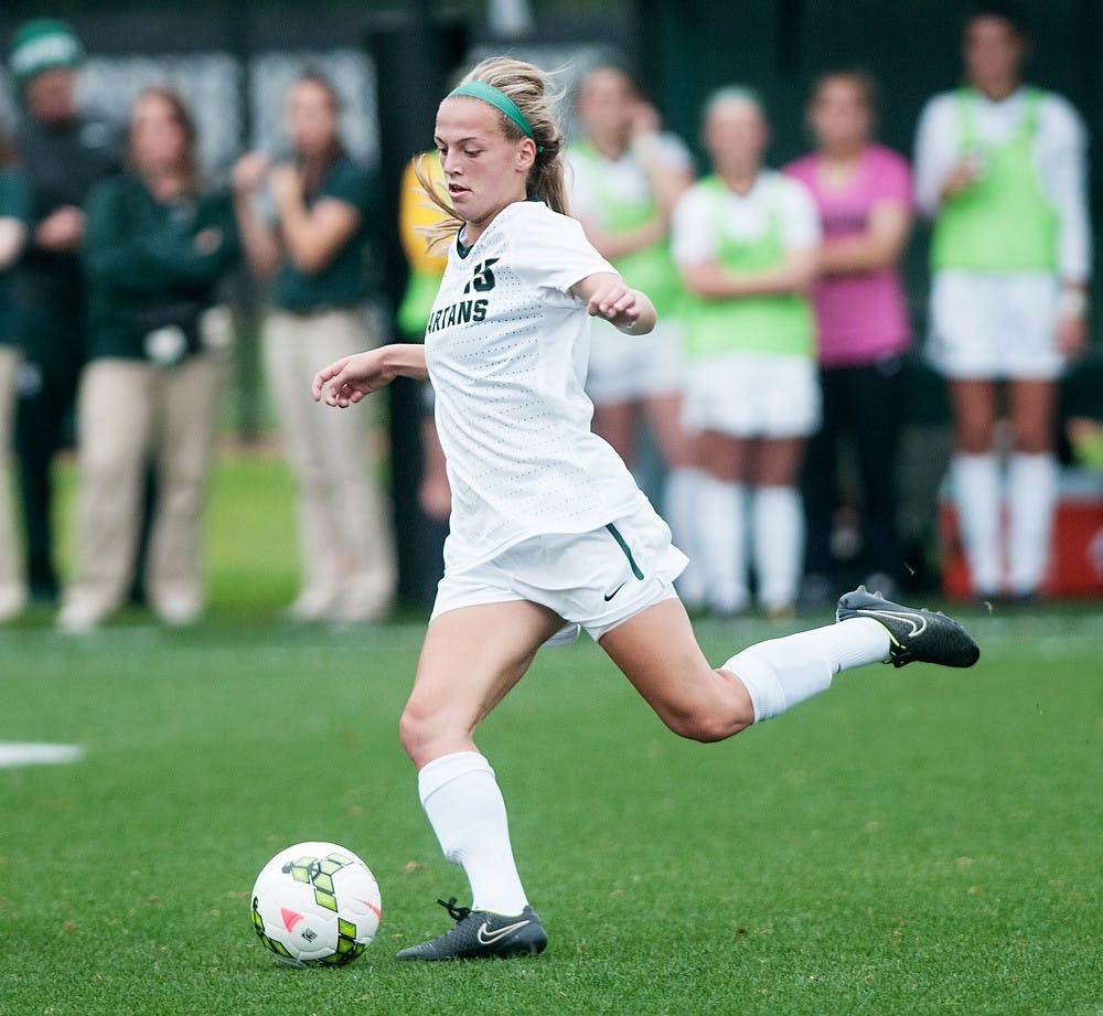 <p>Freshman forward Jamie Cheslik goes for a long pass Oct. 2, 2014, during the game against the University of Iowa at DeMartin Soccer Stadium at Old College Field. The Spartans lost to the Hawkeyes 0-1. Raymond Williams/The State News</p>