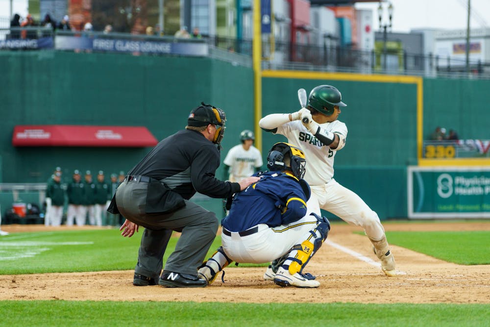 <p>Michigan State redshirt freshman center Christian Williams (5) unable to hit the ball in the bottom of the fourth causing a walk to first. Michigan State lost 18-6 to Michigan on April 15, 2022, at the Lugnut Stadium.</p>