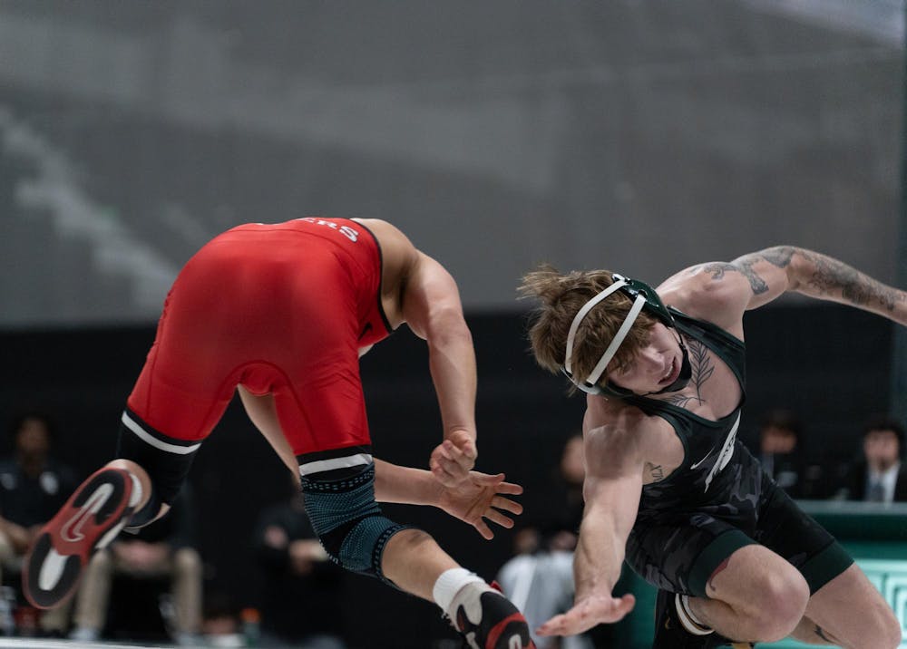 <p>Redshirt junior Nick Corday battles a Rutgers opponent during the dual match at Jenison Field house on Feb. 13, 2026.</p>