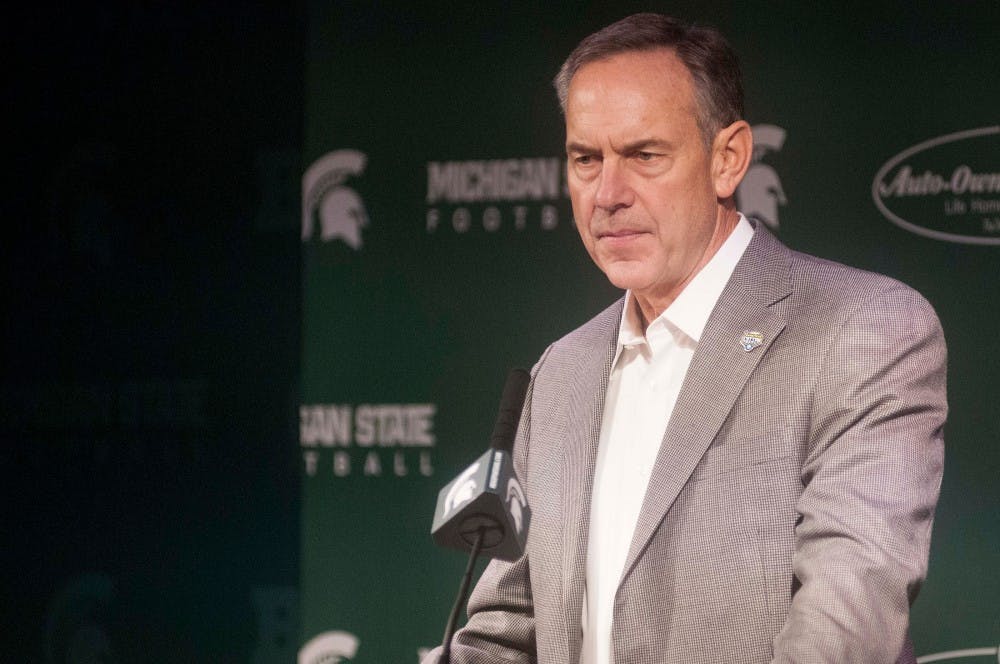 Head coach Mark Dantonio listens to a question during a press conference on Dec. 16, 2015 at Spartan Stadium. Members of the coaching staff discussed team preparations for the upcoming Cotton Bowl against Alabama. 