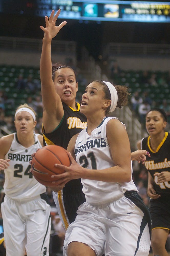 	<p>Junior guard Klarissa Bell attempts a lay up over Wisconsin-Milwaukee guard Emily Decorah on Saturday, Dec. 1, 2012, at Breslin Center. The Spartans defeated Wisconsin-Milwaukee, 81-50, improving their overall record to 7-0. Adam Toolin/The State News</p>