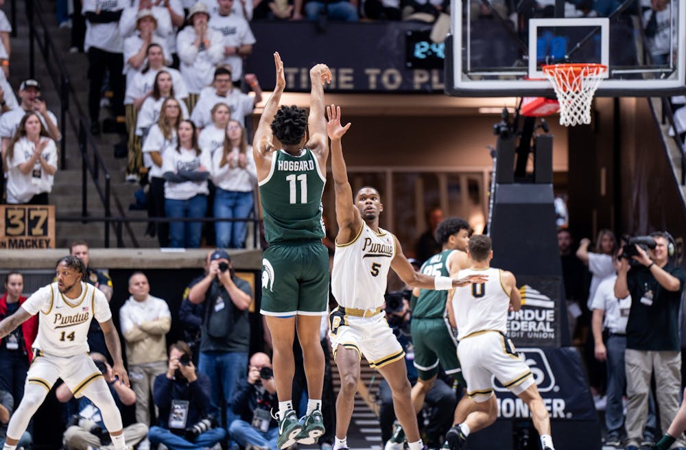 <p>Junior guard A.J. Hoggard (11) attempts to shoot a three-pointer during a game against Purdue at Mackey Arena on Jan. 29, 2023. The Spartans lost to the Boilermakers 77-61.</p>