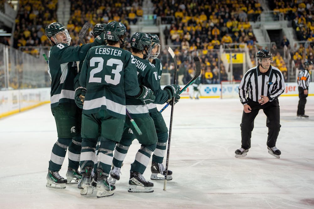 <p>The Spartans celebrating a goal together during a game against University of Michigan at Yost Ice Arena on Jan. 20, 2024. Michigan State pulled off an impressive comeback win to beat the Wolverines 7-5.</p>