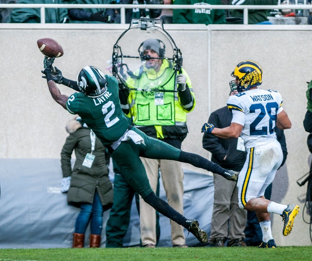 Junior corner back Justin Layne (2) reaches for a pass during the game against Michigan on Oct. 20, 2018 at Spartan Stadium. The Spartans lost to the Wolverines 21-7.