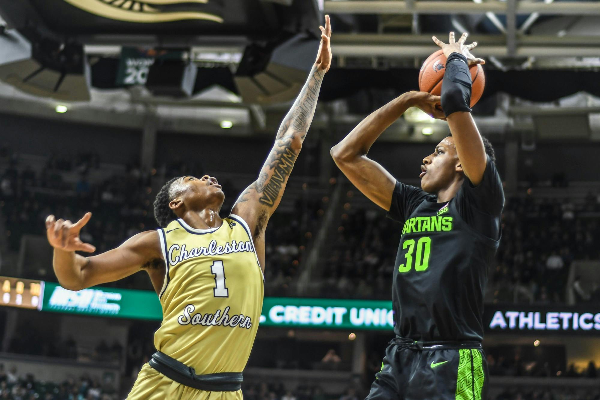 <p>Sophomore forward Marcus Bingham Jr. (30) shoots the ball during the game against the Charleston Southern Buccaneers at Breslin Center on Nov. 18, 2019. The Spartans defeated the Buccaneers, 94-46.</p>