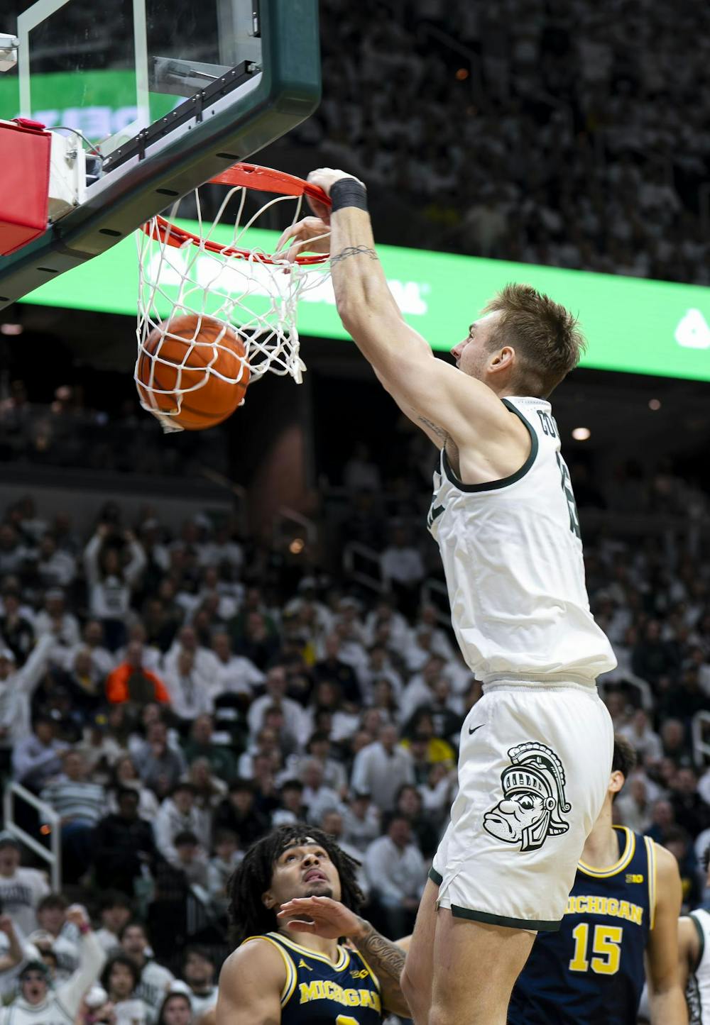 <p>MSU senior center Carson Cooper (15) dunks the ball&nbsp;at the Breslin Student Events Center on Jan. 30, 2026. </p>
