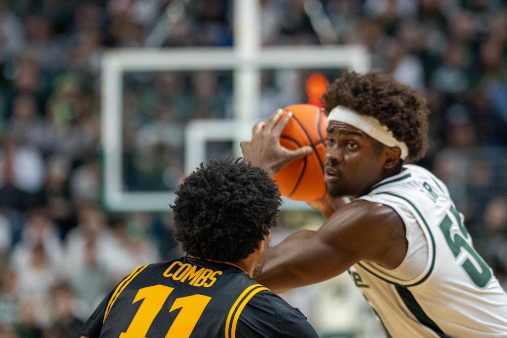 <p>Junior forward Coen Carr (55) protects the ball during the matchup against the University of Iowa at the Breslin Center on Dec. 2, 2025.</p>