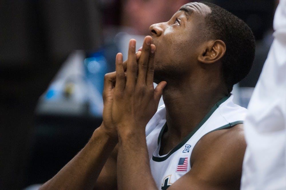 Sophomore guard Lourawls Nairn Jr. sits on the bench and watches the game during the second half of the game on March 13, 2016 at Bankers Life Fieldhouse in Indianapolis, Indiana. The Spartans defeated the Boilermakers, 66-62. 