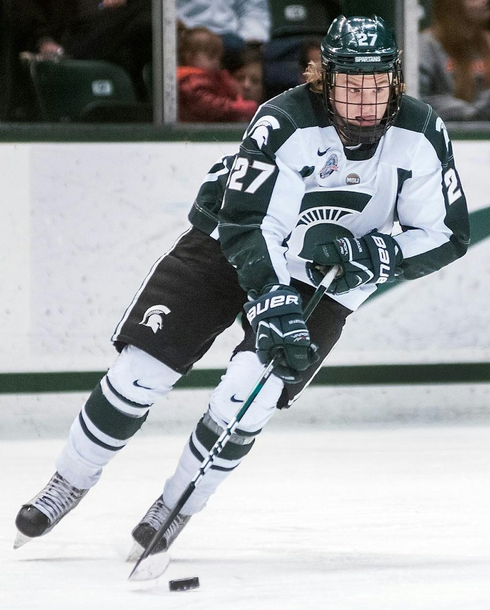 	<p>Sophomore left wing Matt Berry collects a pass Friday, Feb. 15, 2013, at Munn Ice Arena. The Wildcats defeated the Spartans, 5-3, during the first game of the weekend series. Adam Toolin/The State News</p>
