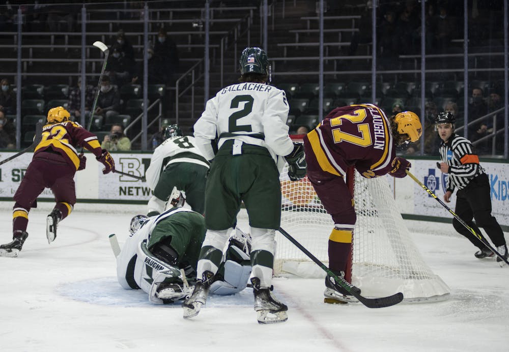 <p>Spartan hockey players at the Spartan’s match against the University of Minnesota Golden Gophers at Munn Ice Arena on Friday, Jan. 7, 2022. </p>