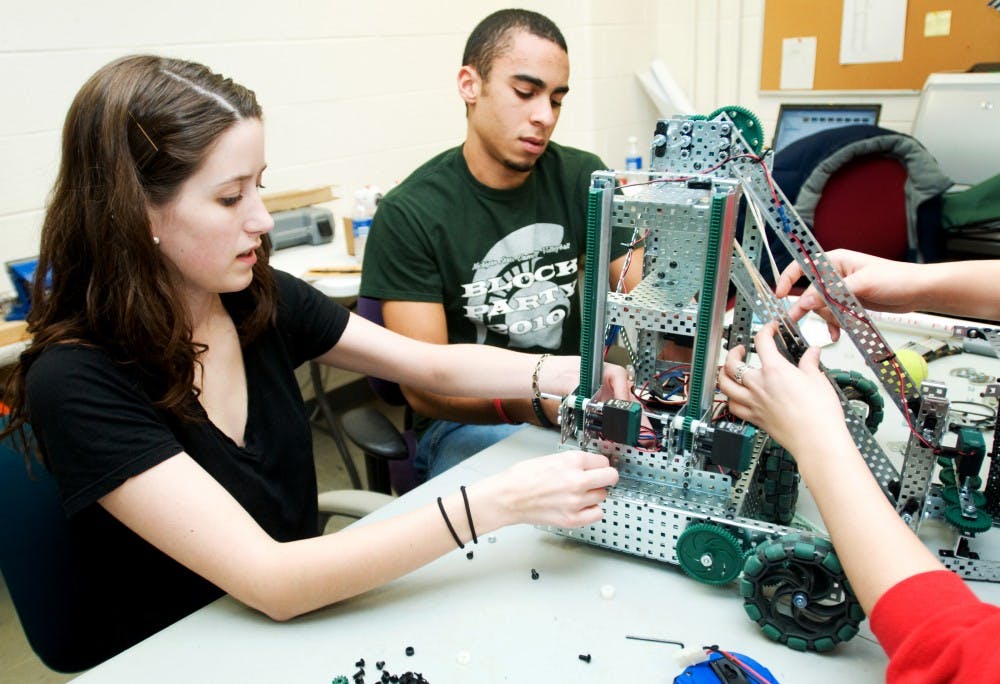 	<p>Chemical engineering sophomore Renee Lynde and mechanical engineering freshman Cody Little work on their robot Monday afternoon. The students are part of a robotics team sponsored by the College of Engineering. The team will be competing in the <span class="caps">VEX</span> Robotics World Championship in April.</p>