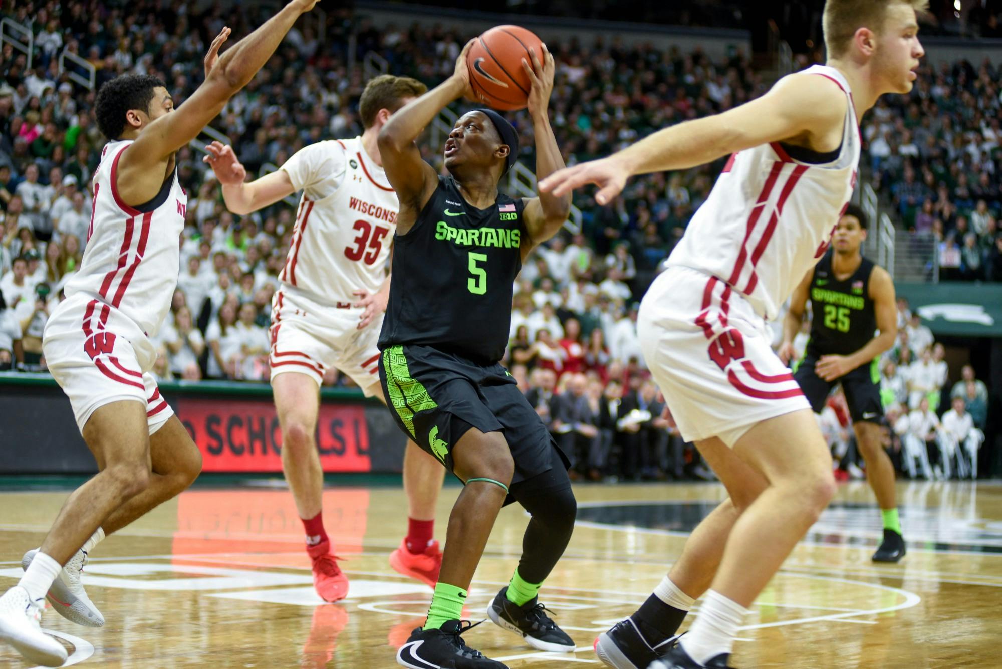 <p>Senior guard Cassius Winston (5) shoots the ball during the game against Wisconsin on Jan. 17, 2020 at Breslin Center. The Spartans defeated the Badgers, 67-55.</p>