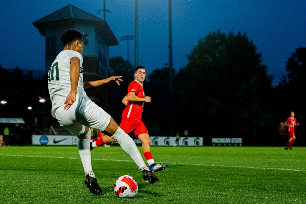Senior defender Olu Ogunwale changes directions with the ball. Michigan State men's soccer team defeated Duquesne 1-0 on Sept. 11, 2021 in East Lansing.