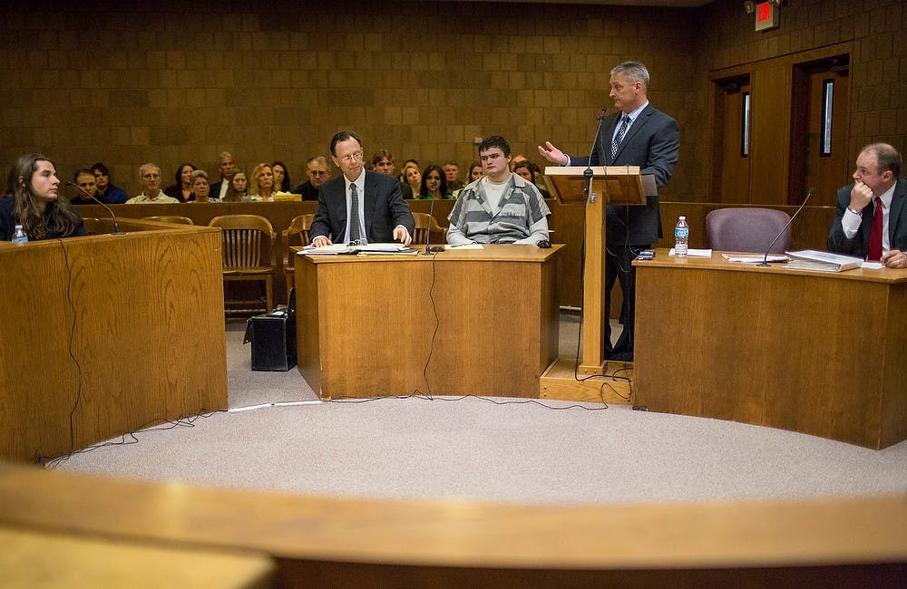 	<p>From left to right, <span class="caps">MSU</span> alumnus Tyler Aho, defense attorney Chris Bergstrom, defendent and Okemos resident Connor McCowan, Ingham County Assistant Prosecutor John Dewane and detective in charge of the investigation Meridian Township police Sgt. Andrew McCready talk during the preliminary exam for the teen accused of stabbing <span class="caps">MSU</span> student Andrew Singler to death, April 18, 2013, at Ingham County District Judge Donald Allen&#8217;s courtroom in Mason, Mich. Kolb/The State News</p>