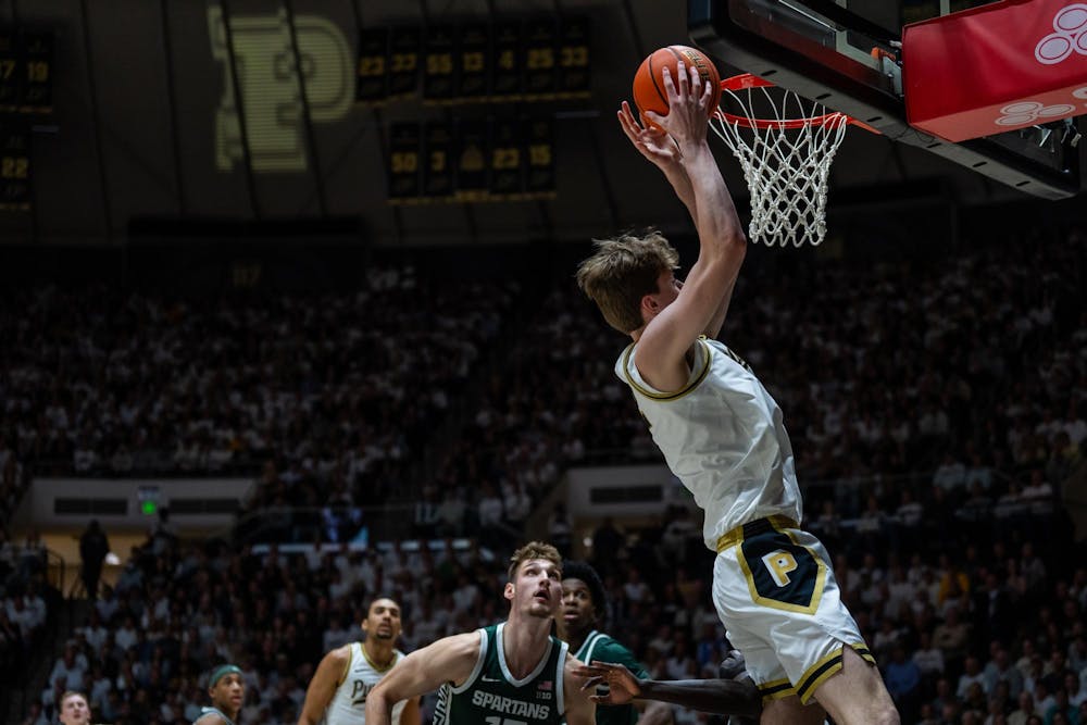 Purdue University's sophomore center Daniel Jacobsen (12) prepares to dunk vs. Michigan State at Mackey Arena in West Lafayette, Indiana on Thursday, Feb. 26, 2026. 