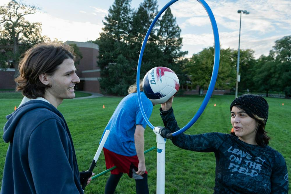 <p>Michigan State quadball senior chaser Owen Connell and freshman keeper Heavenlily Angeline Trelease joke around during their practice at IM East Field in East Lansing, Mich., on Monday, Sept. 21, 2026.</p>