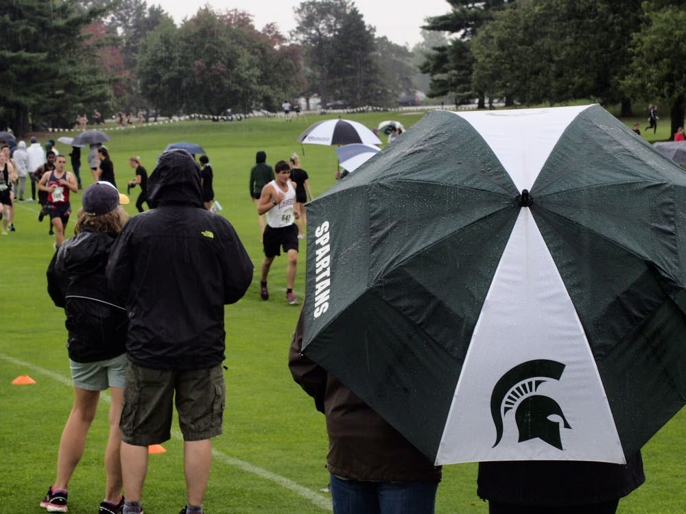 Fans watching the 8000 meter men's race for the Spartan Invitational held at Forest Akers Golf Course on September 13, 2019. 