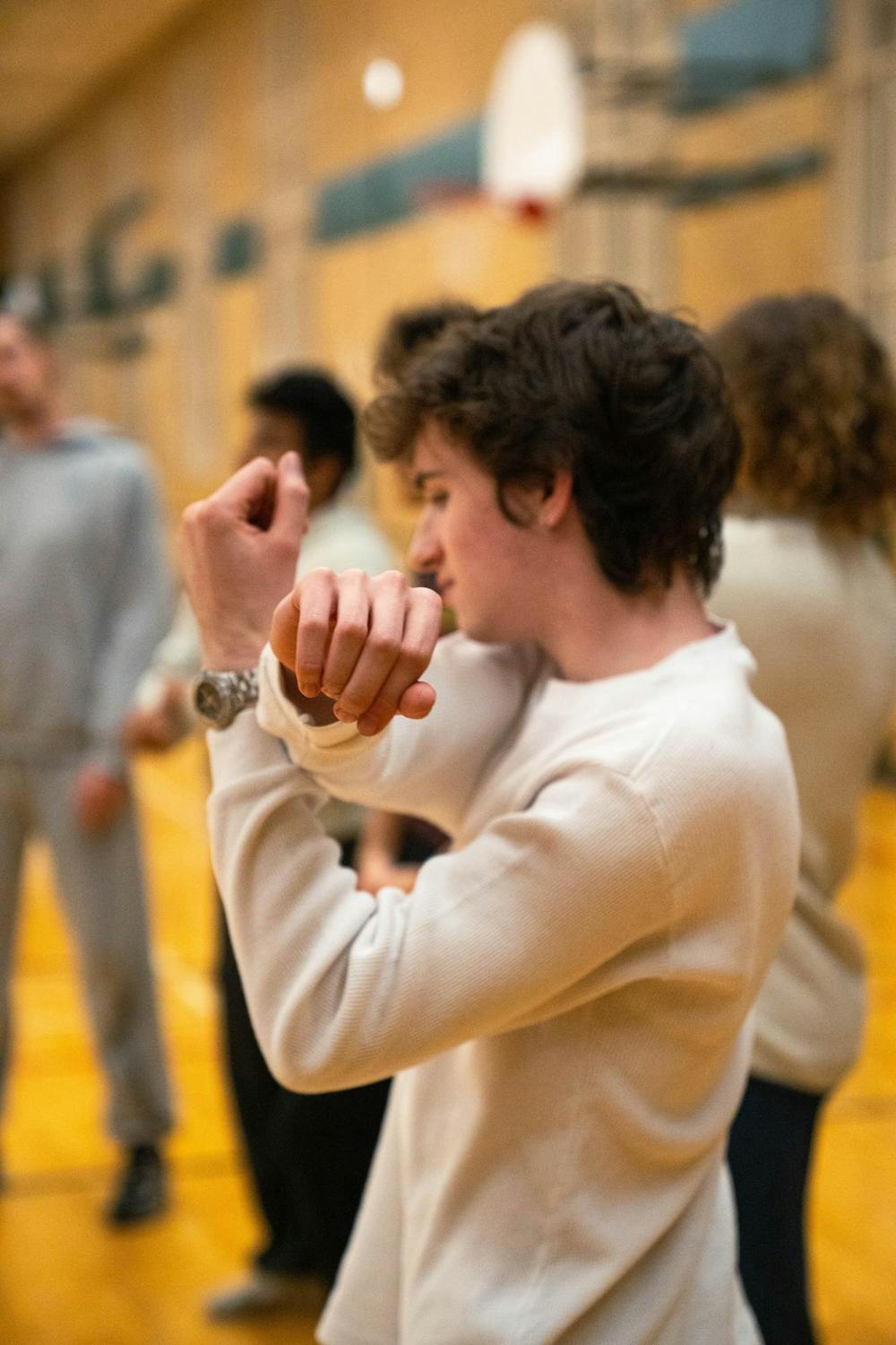 Dance team stretches at IM Circle, in East Lansing, on Dec. 2nd, 2025.