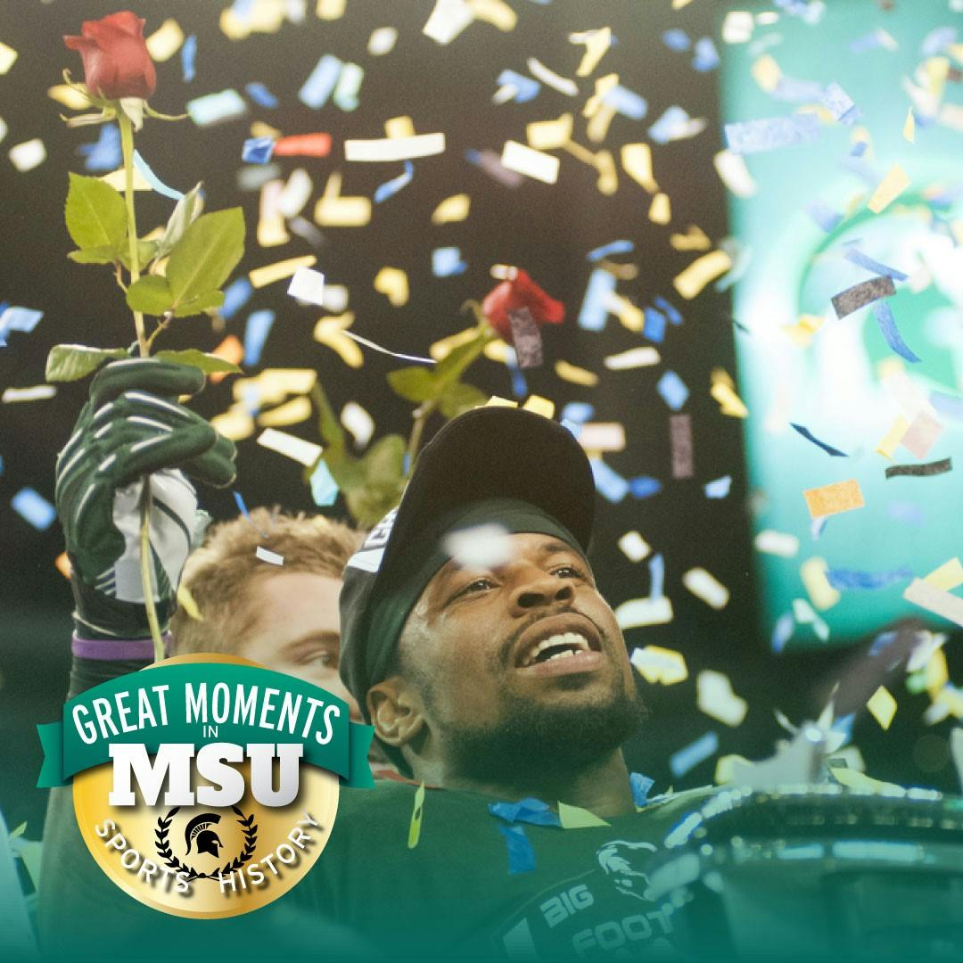 Then-senior linebacker Denicos Allen celebrates the Big Ten Championship win Dec. 7, 2013, at Lucas Oil Stadium in Indianapolis. The Spartans defeated Ohio State, 34-24. Photo by Julia Nagy. Design by Daena Faustino.