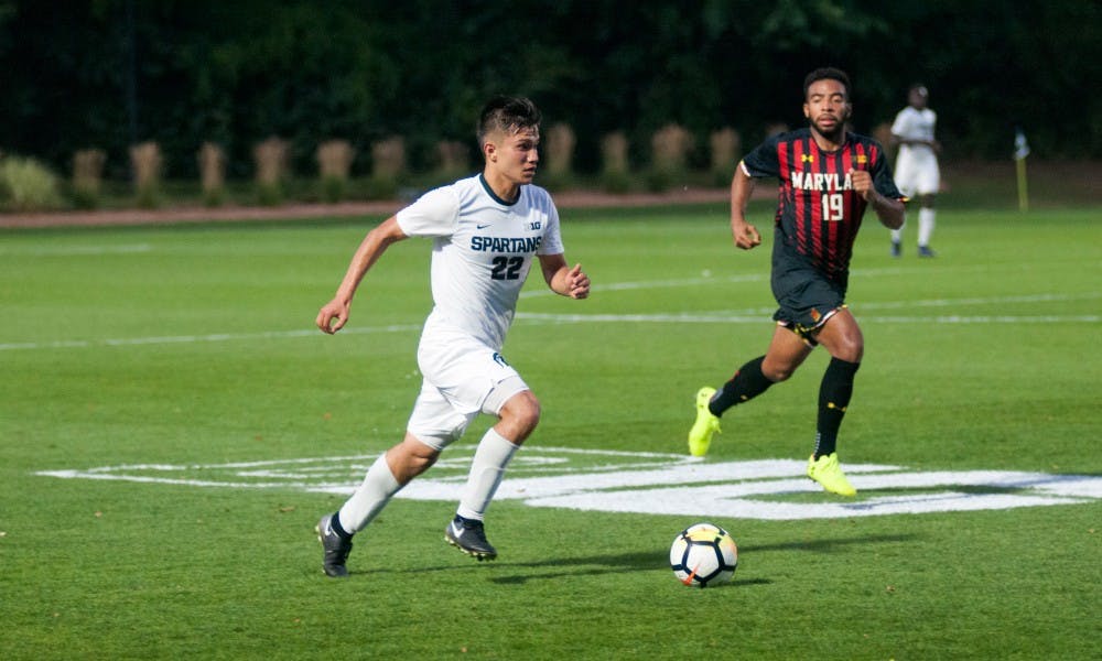 Senior midfielder Ken Krolicki (22) dribbles the ball upfield on Sept. 22, at DeMartin Stadium at Old College Field. The Spartans and the Terrapins tied in a 0-0 draw in 2OT.