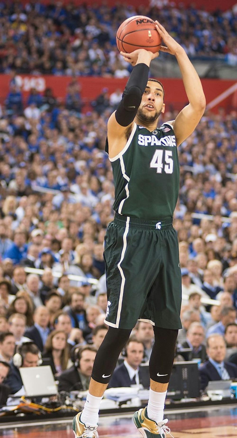 <p>Junior forward Denzel Valentine attempts a basket April 4, 2015, during the semi-final game of the NCAA Tournament in the Final Four round at Lucas Oil Stadium in Indianapolis, Indiana. The Spartans were defeated by the Blue Devils, 81-61. Erin Hampton/The State News</p>