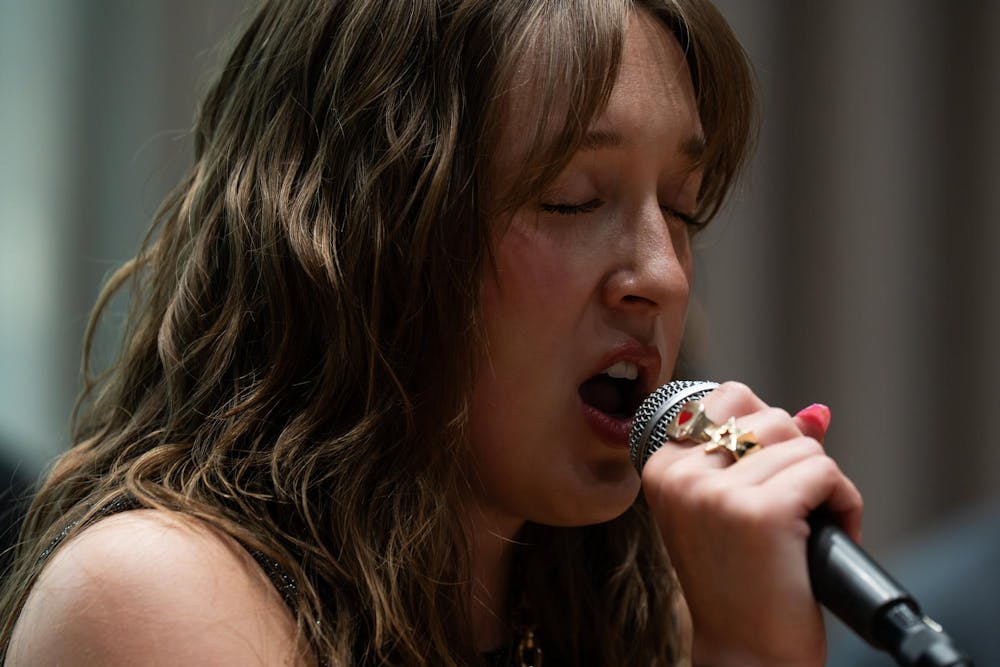 <p>Alina Morse sings at practice for their band, Roxy Riot, at the MSU Music Building in East Lansing, Mich., on July 17, 2026.</p>