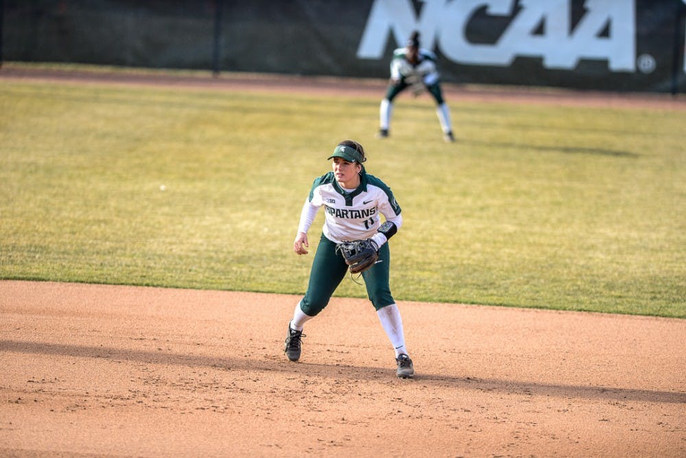 <p>Sophomore shortstop Caitie Ladd (11) scans the field during the game against Oakland on April,3, 2019 at Secchia Stadium. The Spartans beat the Golden Grizzlies,  11-3. </p>