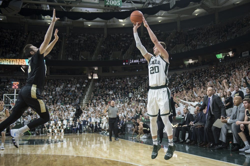 Senior guard Matt McQuaid (20) shoots a 3-pointer during the first half of the men's basketball game against Purdue on Jan. 8, 2018 at Breslin Center. The Spartans led the first half, 39-26.