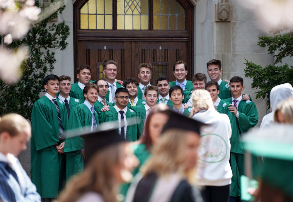 2022 graduating seniors appear to be taking pictures by the Beaumont Tower to celebrate graduation, on May 4, 2022. 