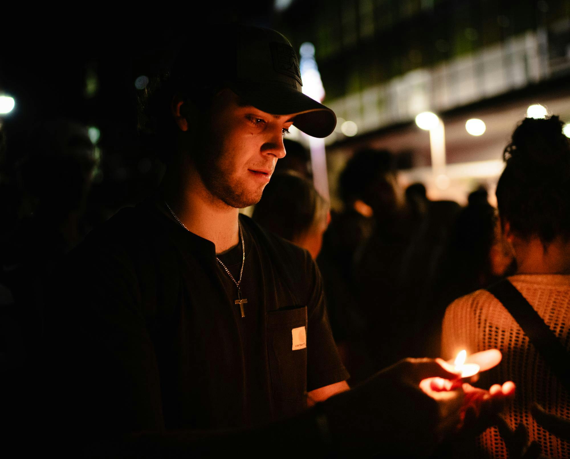 <p>A crowd member with a candle at the Charlie Kirk Vigil outside near Wells Hall in East Lansing, Michigan on Sept. 11, 2025.</p>