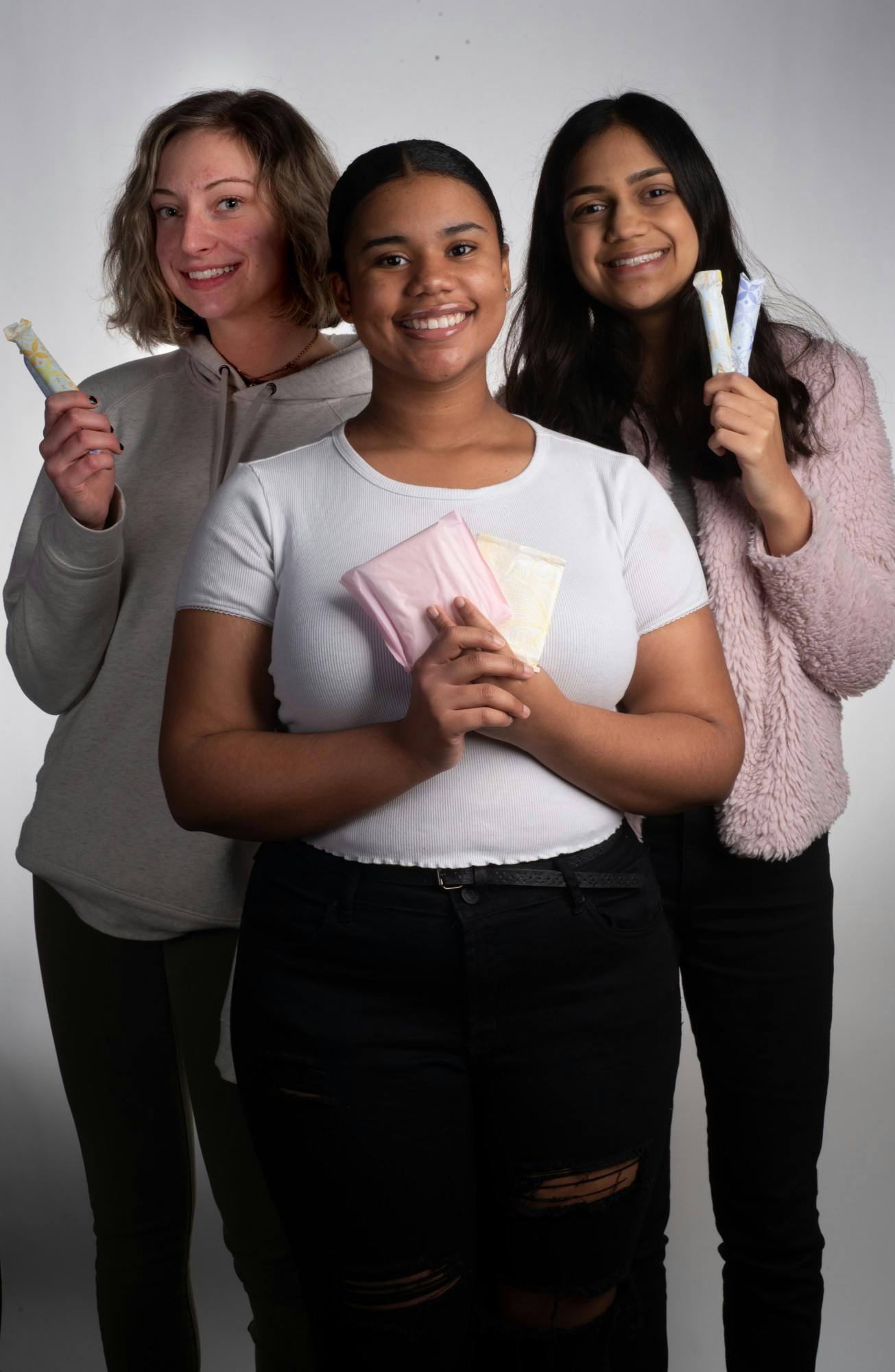 <p>Emily Estrada, left, and Ta’Sheena Williams, center, and Nama Naseem, left, pose for a photo on Feb. 5, 2019.</p>